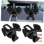 2PCS Seat Headrest Hooks, Cute Bow Purse For Cars, Leather Black New. Price: $5.14.